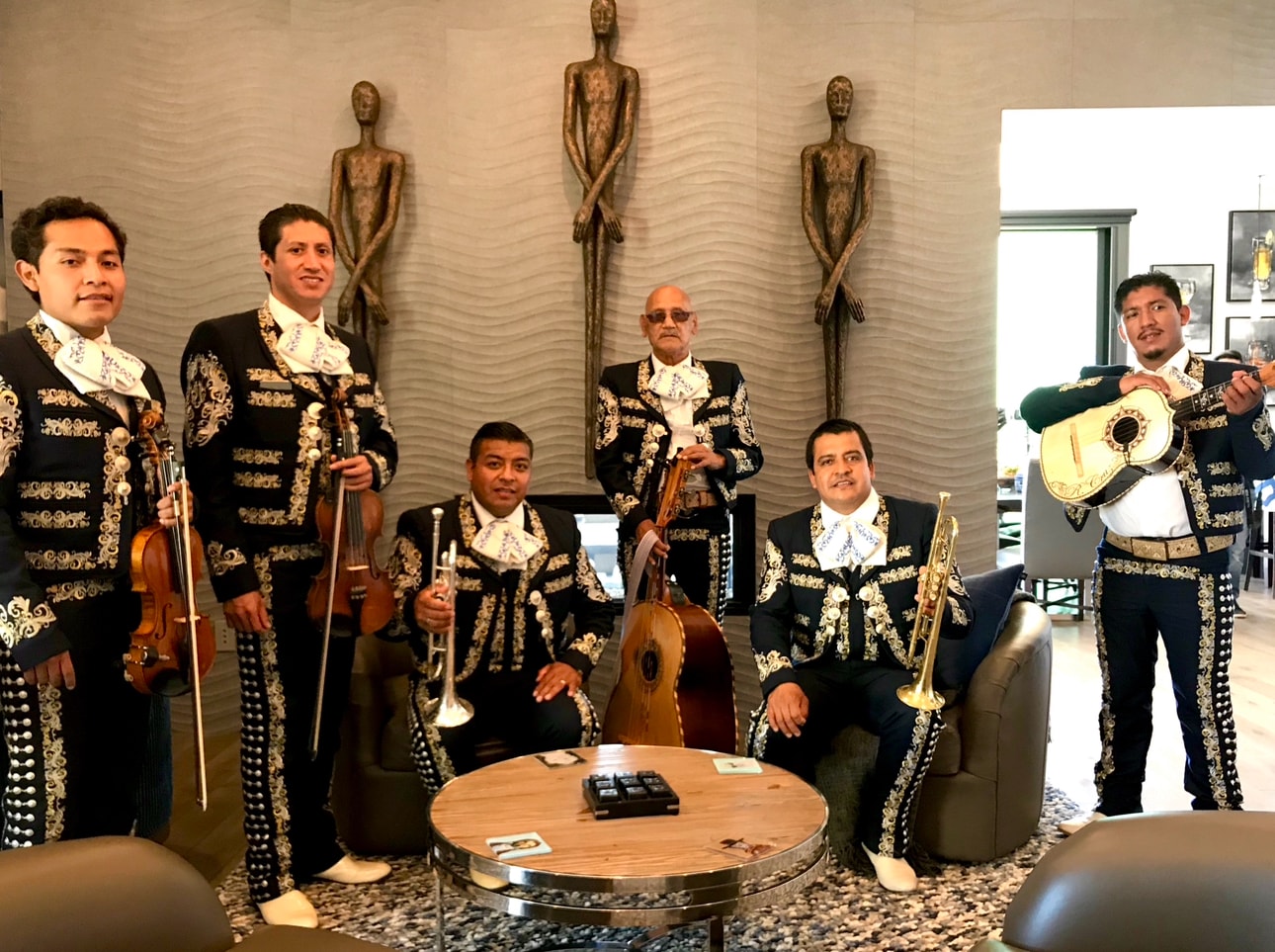 Mariachi Real De Oxnard in ornate black and gold suits